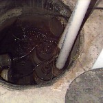Sump Pump Correctly Installed System in to hole in floor