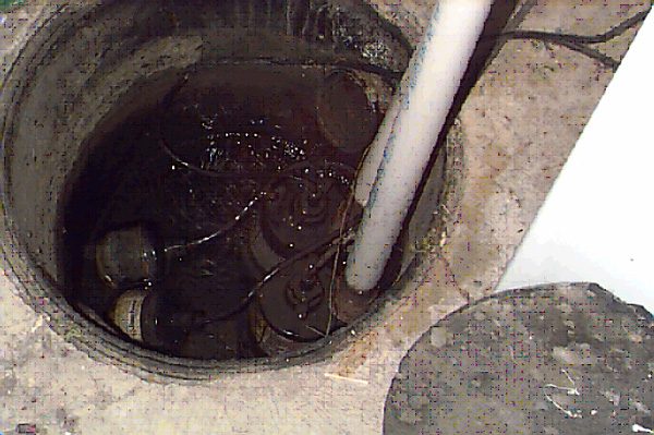 Sump Pump Correctly Installed System in to hole in floor