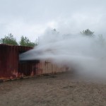 Hutchinson Fire Department Training water spraying from within building