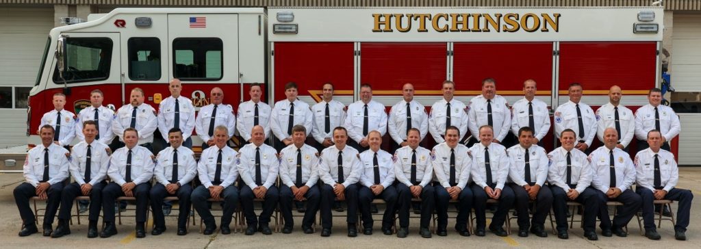 Fire Department Team lined up in front of a fire truck