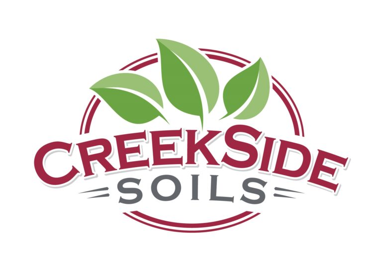 Logo for CreekSide Soils featuring three green leaves above the company name, with CreekSide in bold red letters and Soils in gray below, all enclosed by a red circular outline.